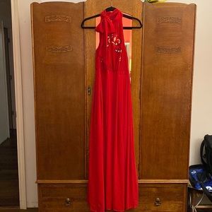 Beautiful red halter style long dress. Perfect for a Holiday Party.